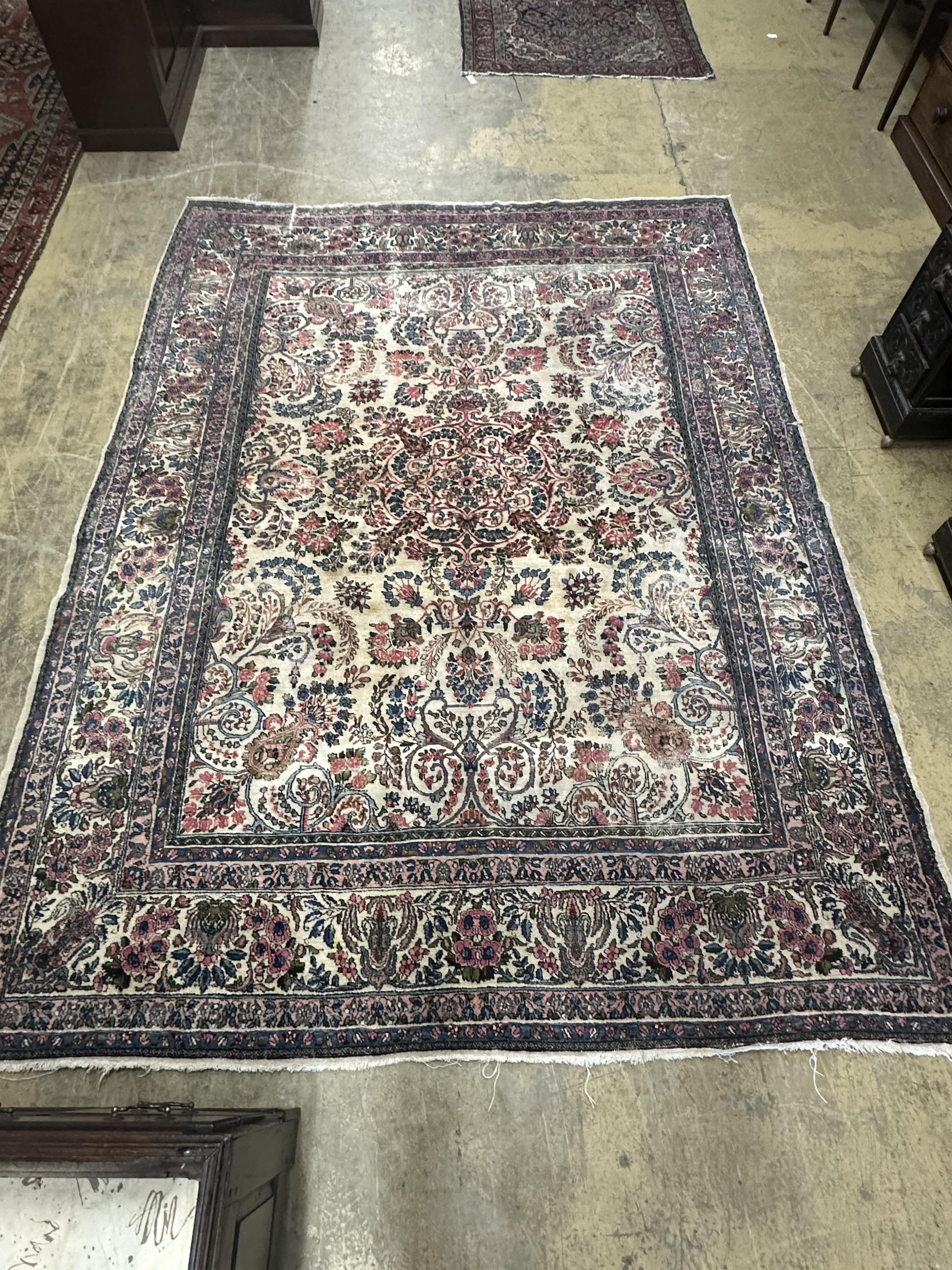 A North West Persian ivory ground carpet, 326 x 232cm. Condition - fair